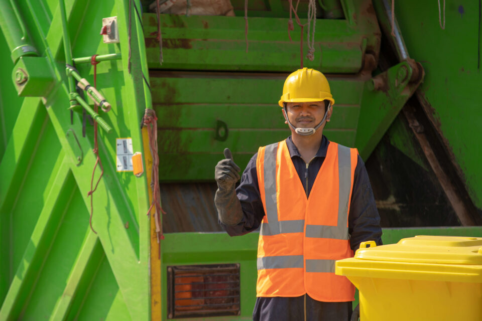 garbage-collector-happy-male-worker-with-dustbin-street-during-day (1)