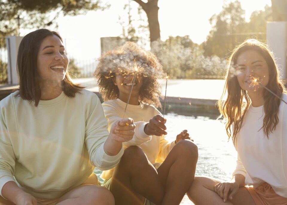 happy-women-with-fireworks-medium-shot